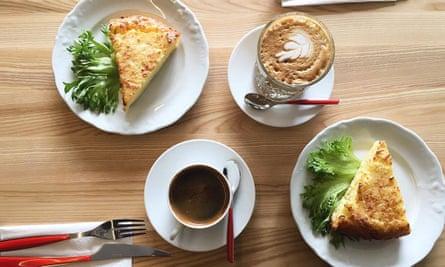 Omelettes and coffee on a wooden table at T35 Bakery, Kalamaja, Tallinn, Estonia.